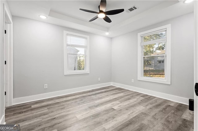 358 Roy St SW, Atlanta, GA 30310 - unfurnished room featuring plenty of natural light, a raised ceiling, recessed lighting, wood finished floors, and baseboards