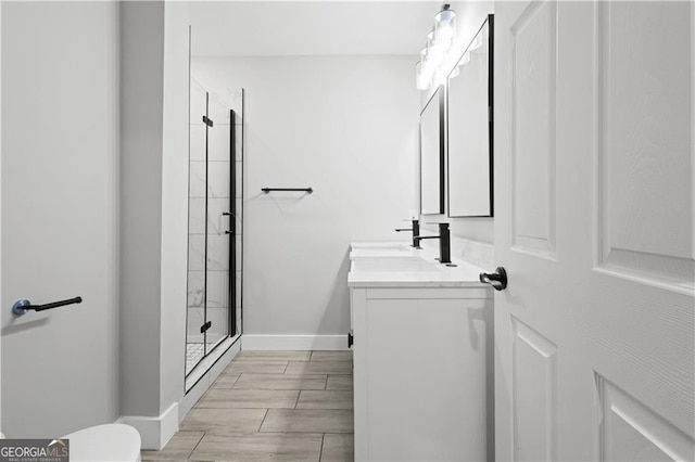 358 Roy St SW, Atlanta, GA 30310 - bathroom featuring a shower stall, vanity, baseboards, toilet, and wood finish floors
