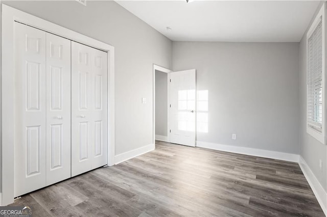 358 Roy St SW, Atlanta, GA 30310 - unfurnished bedroom featuring wood finished floors, a closet, and baseboards