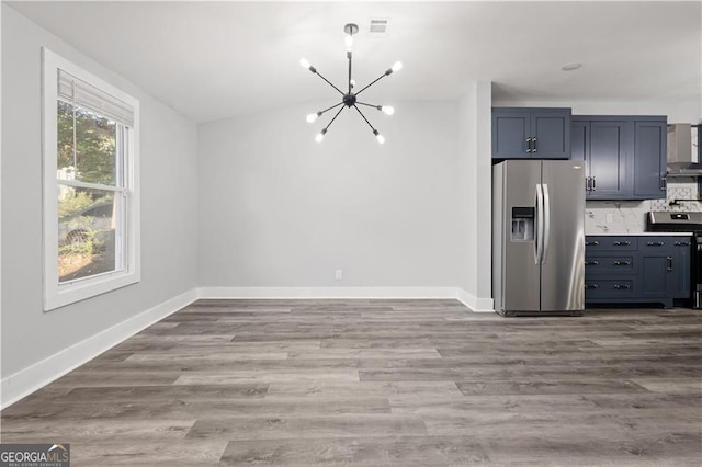 358 Roy St SW, Atlanta, GA 30310 - kitchen featuring stainless steel appliances, a chandelier, baseboards, wood finished floors, and tasteful backsplash