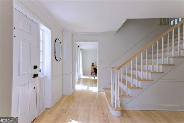 3811 Valley Green Dr, Marietta, GA 30068 - entrance foyer with light wood-style floors, stairs, baseboards, and ornamental molding