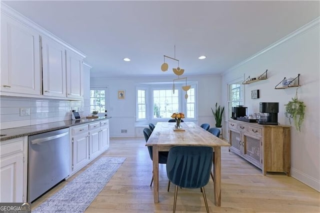 3811 Valley Green Dr, Marietta, GA 30068 - kitchen with stainless steel dishwasher, ornamental molding, white cabinets, decorative backsplash, and light wood finished floors