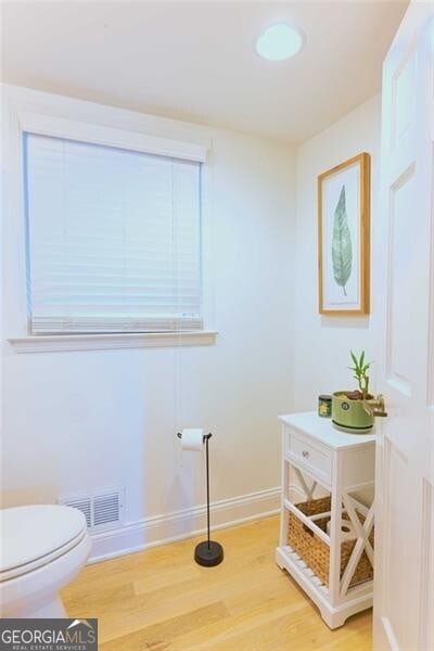 3811 Valley Green Dr, Marietta, GA 30068 - bathroom featuring wood finished floors, toilet, and baseboards