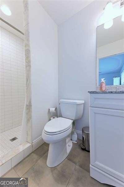 3811 Valley Green Dr, Marietta, GA 30068 - bathroom featuring toilet, a shower stall, tile patterned floors, and vanity