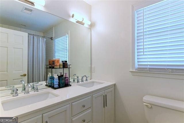 3811 Valley Green Dr, Marietta, GA 30068 - bathroom with toilet, double vanity, and a shower with curtain