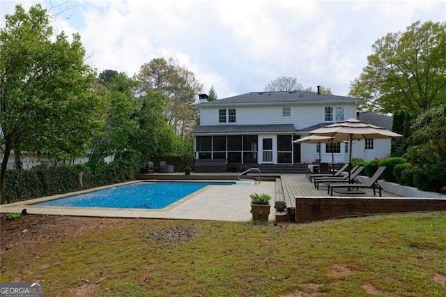 3811 Valley Green Dr, Marietta, GA 30068 - rear view of property with a sunroom, an outdoor pool, a lawn, and a patio
