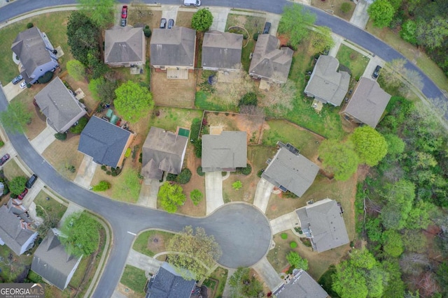 birds eye view of property with a residential view