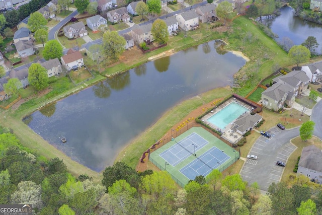 bird's eye view featuring a water view and a residential view