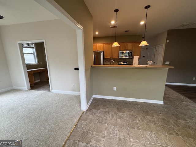 kitchen with stainless steel appliances, tasteful backsplash, baseboards, brown cabinets, and decorative light fixtures
