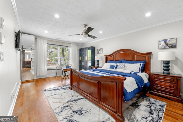 292 Old Rosser Rd, Stone Mountain, GA 30087 - bedroom featuring crown molding, light wood finished floors, recessed lighting, and a textured ceiling