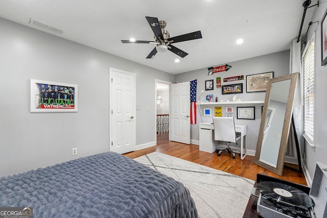 292 Old Rosser Rd, Stone Mountain, GA 30087 - bedroom with ceiling fan, recessed lighting, baseboards, wood finished floors, and visible vents