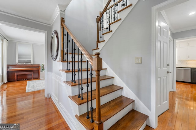 292 Old Rosser Rd, Stone Mountain, GA 30087 - stairs featuring crown molding and hardwood / wood-style flooring