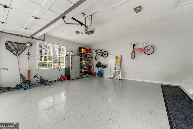292 Old Rosser Rd, Stone Mountain, GA 30087 - garage featuring baseboards and a garage door opener
