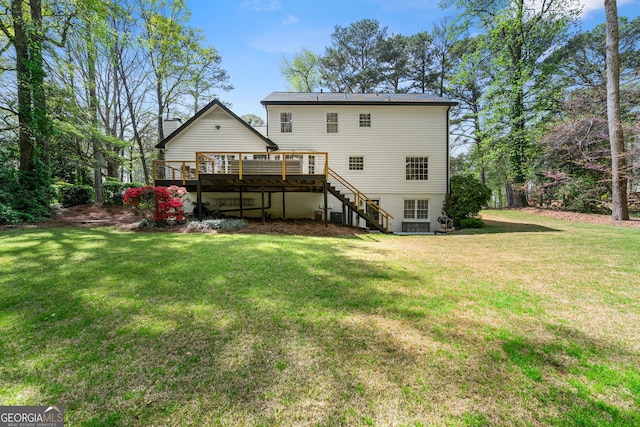 292 Old Rosser Rd, Stone Mountain, GA 30087 - rear view of property with a lawn, a wooden deck, and stairs