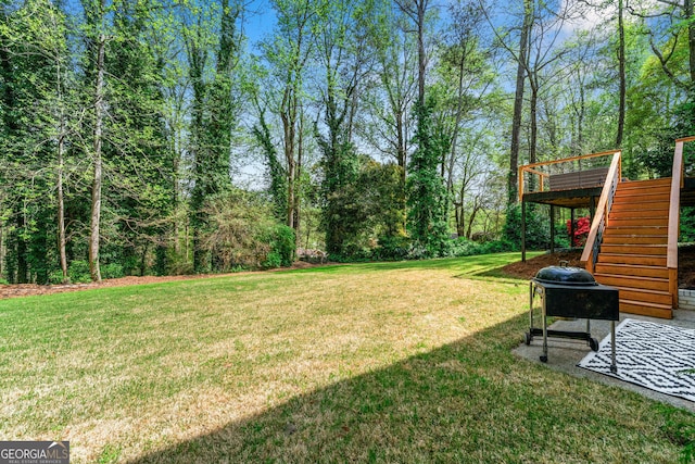 292 Old Rosser Rd, Stone Mountain, GA 30087 - view of yard with a wooden deck and stairway