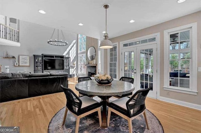 dining space featuring recessed lighting, french doors, baseboards, and wood finished floors