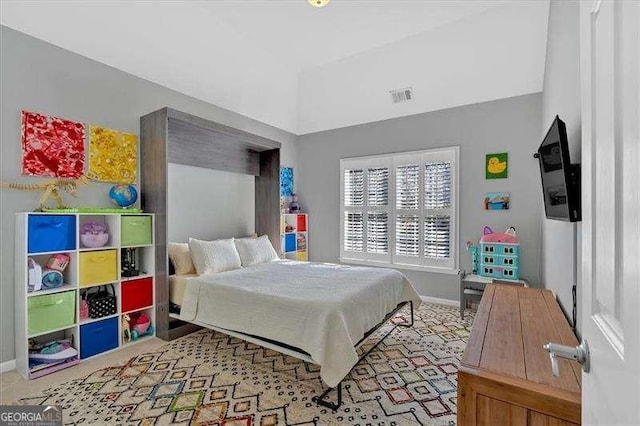 bedroom with visible vents and baseboards