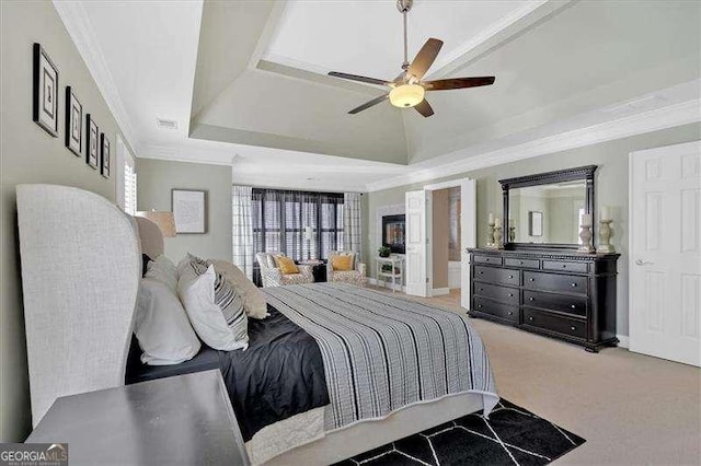 bedroom featuring carpet flooring, ceiling fan, ornamental molding, and a raised ceiling