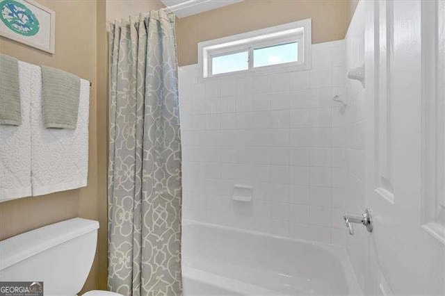 full bath with shower / bath combo and toilet