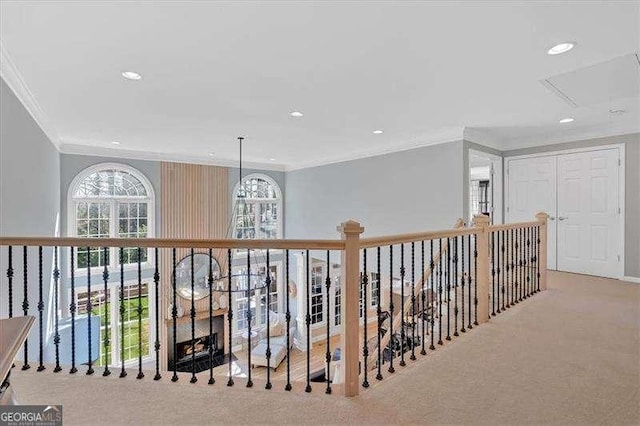 hall with crown molding, carpet floors, and recessed lighting