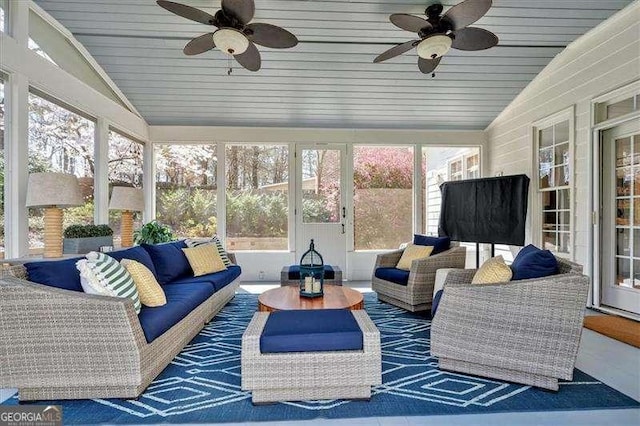 sunroom with an outdoor living space and ceiling fan