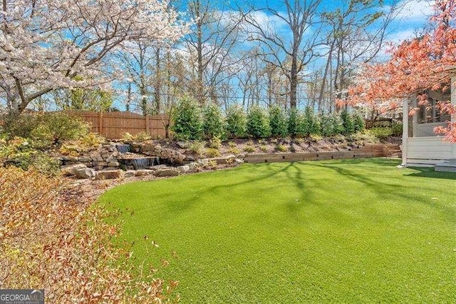 view of yard with fence