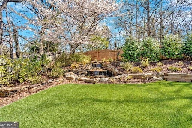 view of yard featuring fence
