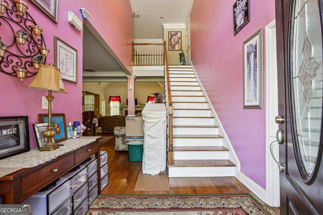 stairs featuring baseboards and wood finished floors