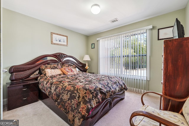 bedroom with carpet and visible vents