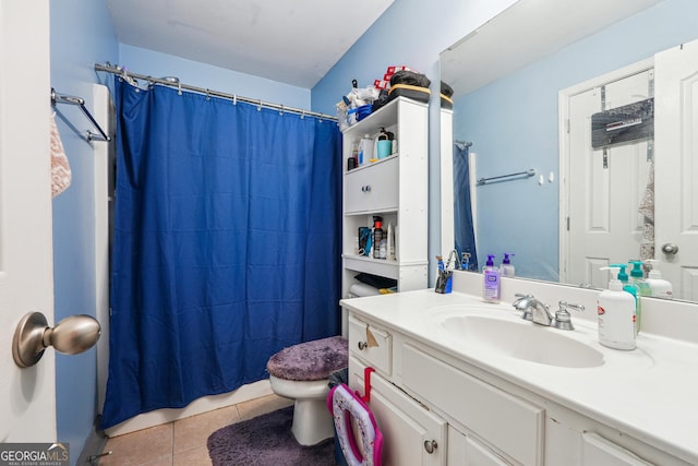 full bath with curtained shower, vanity, tile patterned flooring, and toilet