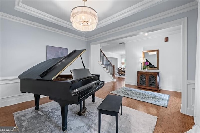 715 Saybeck Way, Milton, GA 30004 - sitting room with a chandelier, wood finished floors, stairs, and ornamental molding