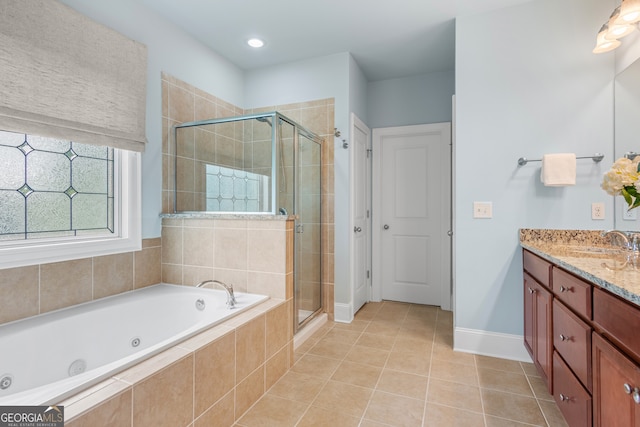 full bath featuring vanity, a shower stall, tile patterned flooring, and a jetted tub