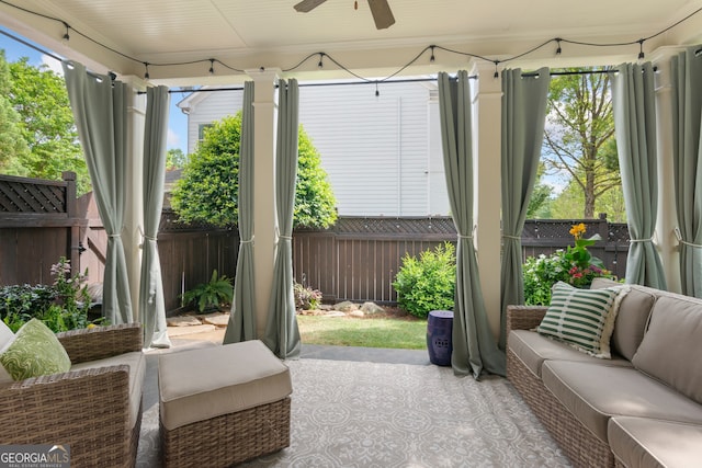 sunroom / solarium with ceiling fan and outdoor lounge area