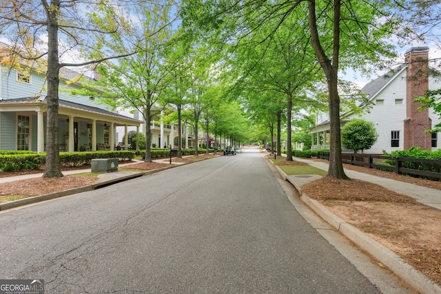 view of street with sidewalks and curbs