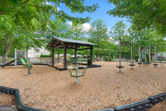 community play area with a gazebo and fence