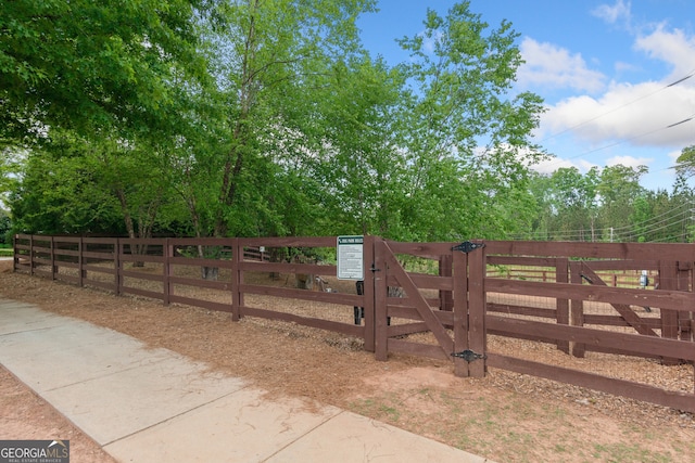 view of gate featuring fence