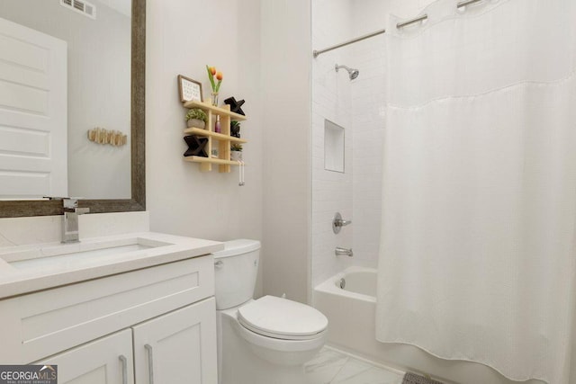 4980 Wildeoak Trl, Douglasville, GA 30135 - full bathroom with toilet, vanity, shower / bath combo with shower curtain, marble finish floor, and visible vents
