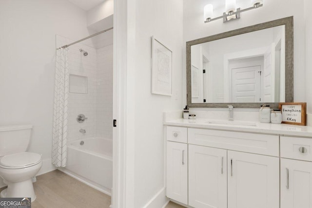 4980 Wildeoak Trl, Douglasville, GA 30135 - bathroom with toilet, vanity, shower / bath combo, wood finished floors, and baseboards