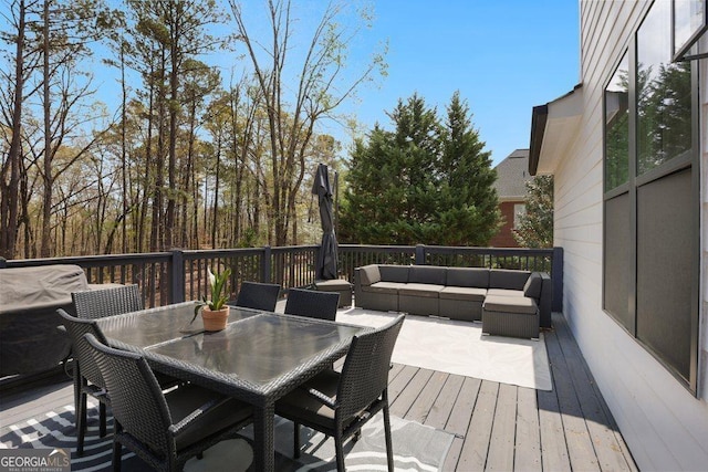 4980 Wildeoak Trl, Douglasville, GA 30135 - wooden terrace with an outdoor hangout area and outdoor dining space