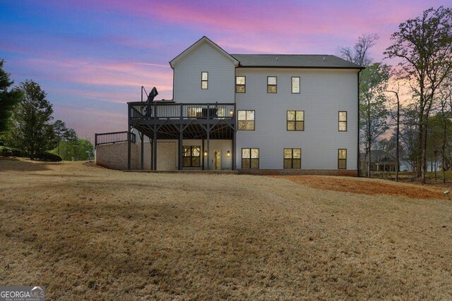 4980 Wildeoak Trl, Douglasville, GA 30135 - rear view of house with a lawn and a wooden deck