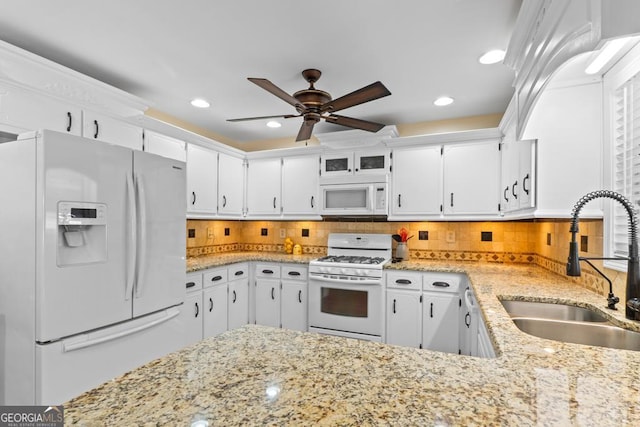 155 Duncans Mill Dr, Locust Grove, GA 30248 - kitchen featuring white cabinets, a sink, a ceiling fan, and white appliances