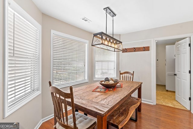 155 Duncans Mill Dr, Locust Grove, GA 30248 - dining area featuring visible vents, wood finished floors, and plenty of natural light