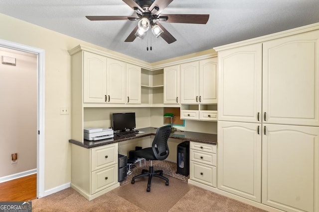 155 Duncans Mill Dr, Locust Grove, GA 30248 - office with a textured ceiling, baseboards, ceiling fan, built in study area, and light colored carpet