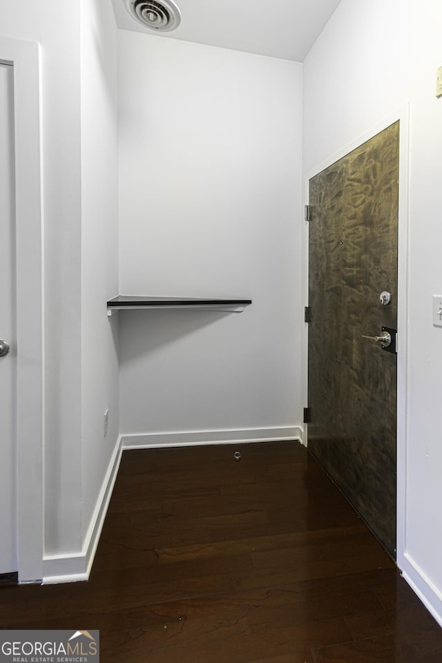 interior space with visible vents and wood finished floors