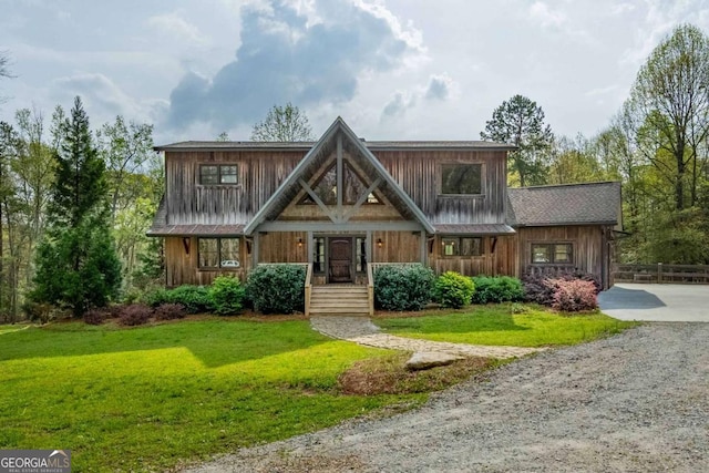 142 Holland Dam Dr, Maysville, GA 30558 - view of front of home featuring gravel driveway, a front yard, and board and batten siding