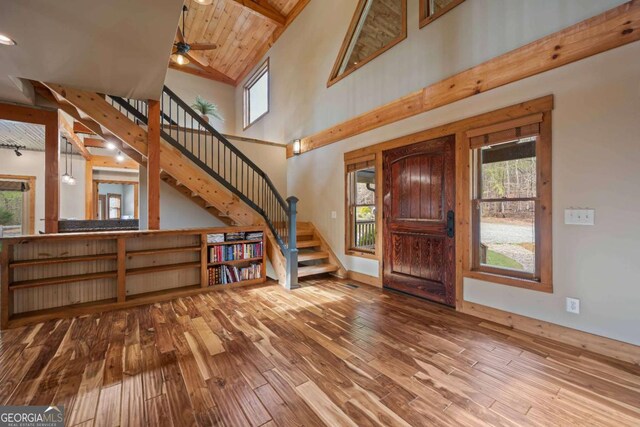142 Holland Dam Dr, Maysville, GA 30558 - entryway featuring wood finished floors, ceiling fan, stairway, and a healthy amount of sunlight