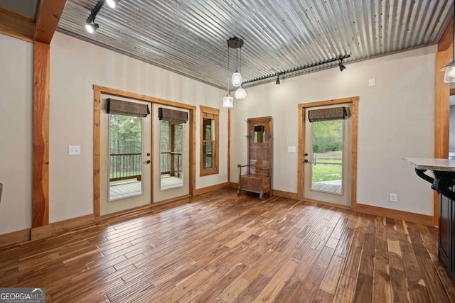 142 Holland Dam Dr, Maysville, GA 30558 - doorway to outside with baseboards, wood finished floors, rail lighting, and french doors