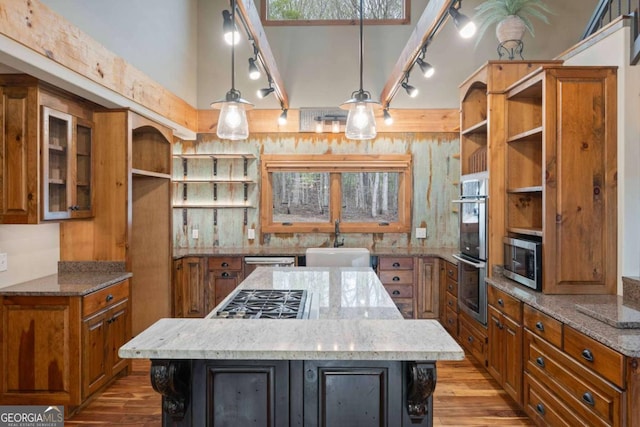 142 Holland Dam Dr, Maysville, GA 30558 - kitchen featuring a sink, brown cabinets, open shelves, and stainless steel appliances