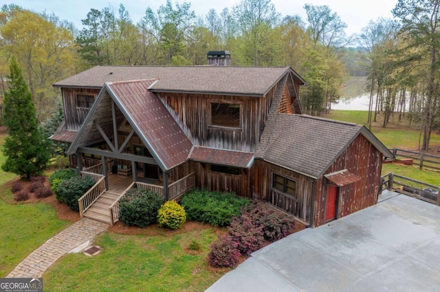 142 Holland Dam Dr, Maysville, GA 30558 - view of front facade with covered porch, board and batten siding, and a front yard