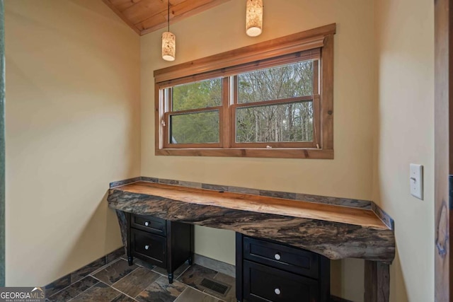 142 Holland Dam Dr, Maysville, GA 30558 - bathroom with stone finish flooring, baseboards, and vaulted ceiling